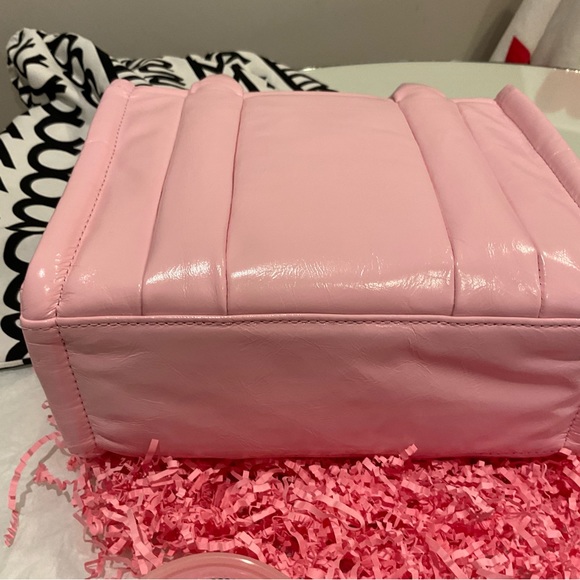 The shiny mini tote in bubble gum pink use one time too small for me. - Picture 3 of 5